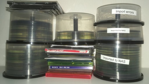 a pile of CDs and DVDs